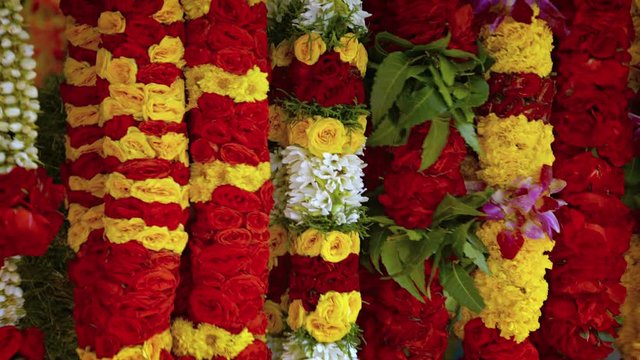 Flower garlands for sale at the singapore market. UltraHD 4k footage