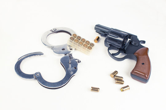Pistol, handcuffs ammunition and money.
