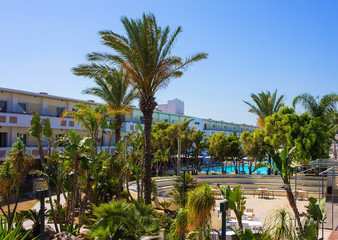 palm trees and green spaces in the resort of European modern hotel