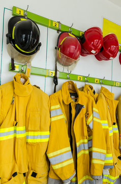 Firefighter suits and helmets hanging