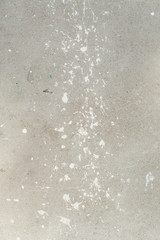 White splash on gray background concrete wall, messy, splotchy, surface. Decorative wet paint drops, abstract art.