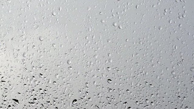 Raindrop on glass window pane