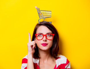 young woman with cart © Masson