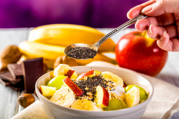 Healthy breakfast with yogurt, apple, banana and chia seeds