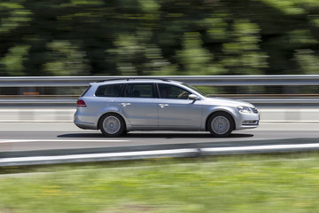 Fototapeta na wymiar car in fast motion with panning effect on highway