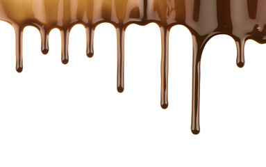 Melted chocolate streams on white background
