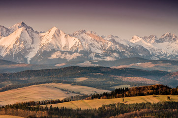 Autumn panorama of Tatra mountains and brown hills