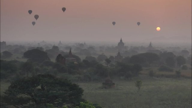 Scenic sunrise old pagoda with balloon at Bagan Myanmar
