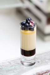 blueberry parfait in tall glass on the table