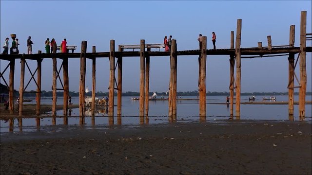 The villagers and tourist walking on U-Bein bridge