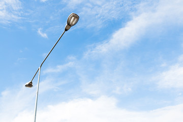 Street light on white cloud and blue sky background