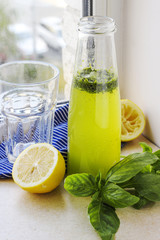 Summer drink with lemon, basil and soda