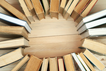 Naklejka premium Pile of books, hardback books on wooden table. Knowledge is important. Copy space