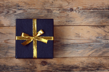black gift box on wooden table