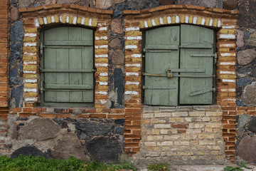 Fototapeta na wymiar Two windows in the old wall