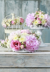Floral arrangement with pink peonies, tiny roses, chrysanthemums
