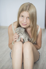 girl with a cat in her arms