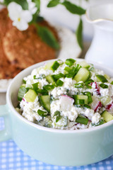 Breakfast table. Bread and salad, oatmeal cookies and jug of mil