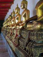 Fototapeta premium Ancient buddhist statues in old temple