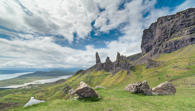 Cloudy Bright Sky over Old Man of Storr Summit at the Isle of Skye in Scotland