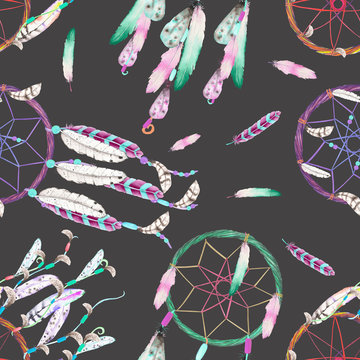 Seamless pattern with dreamcatchers and feathers in the air, hand drawn in watercolor on a dark background