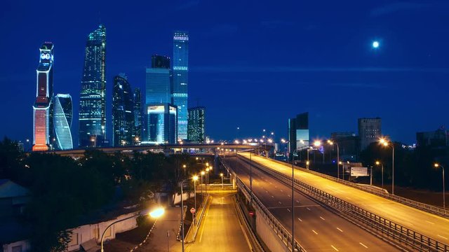 Moscow City At Night With Moon, Moscow International Business Center. Time Lapse UHD 4K 3840x2160. 30 fps