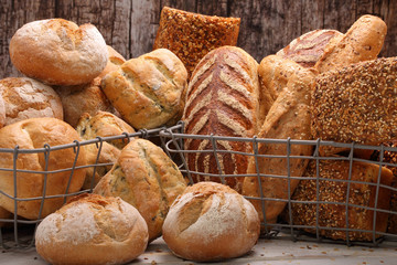 Various types of bread in a metal basket