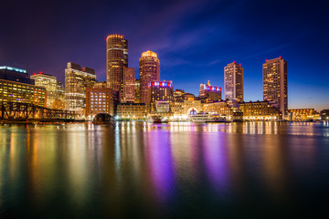 The downtown skyline at night, seen from Fort Point in Boston, M