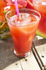 watermelon juice on wooden background