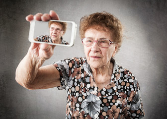 Old woman photographed yourself on the phone