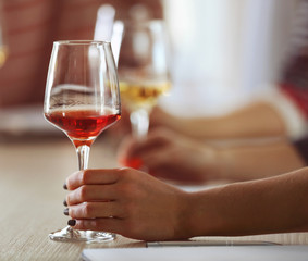 Experts tasting new sorts of wine at the table