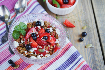 Dessert with fresh berries, cottage  cheese, granola and berries