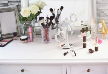 Cosmetic set on light dressing table