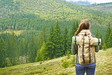 Female tourist in mountains
