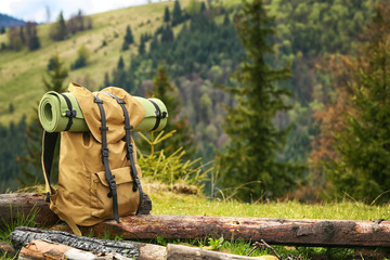 Tourist beg pack on mountain slope