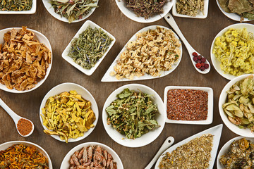 Natural flower and herb selection in ceramic bowls, close up