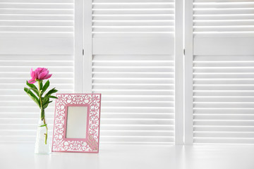 Beautiful peony flower on white folding screen background