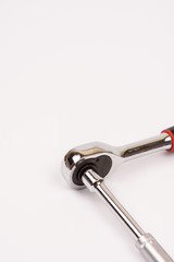 Rachet with socket over white background with copy space