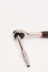 Rachet with socket over white background with copy space