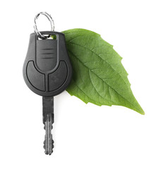 Car key with green leaf, isolated on white