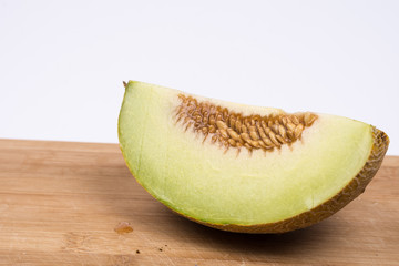 Sliced melon isolated over white background with copy space