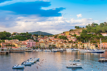 Panoramic view over the famous attraction port of  Porto Azzurro at sunset, in Italy - Elba island