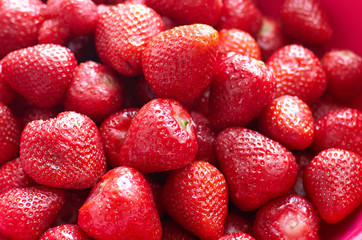 Fresh red bright strawberries. Macro, top view/A background of fresh strawberries fruit, close up