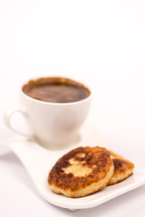 Cup of coffee with homemade donuts
