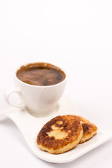 Cup of coffee with homemade donuts