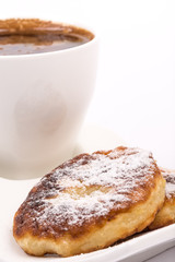 Closeup macro powdered donuts isolated over white background