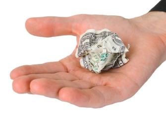 Male hand holding crumpled dollar