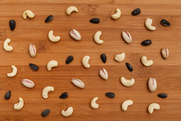 Composition of nuts pattern - mix cashews, sunflower seed, pistachios.