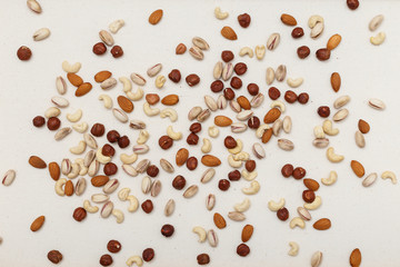 Composition of nuts pattern - mix hazelnuts, cashews, almonds, pistachios.
