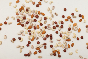 Composition of nuts pattern - mix hazelnuts, cashews, almonds, pistachios.